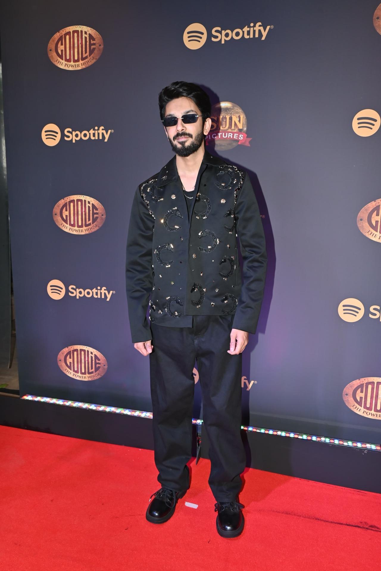 Coolie music composer Anirudh Ravichander was seen at the music event of the upcoming film looking daper in a black suit.